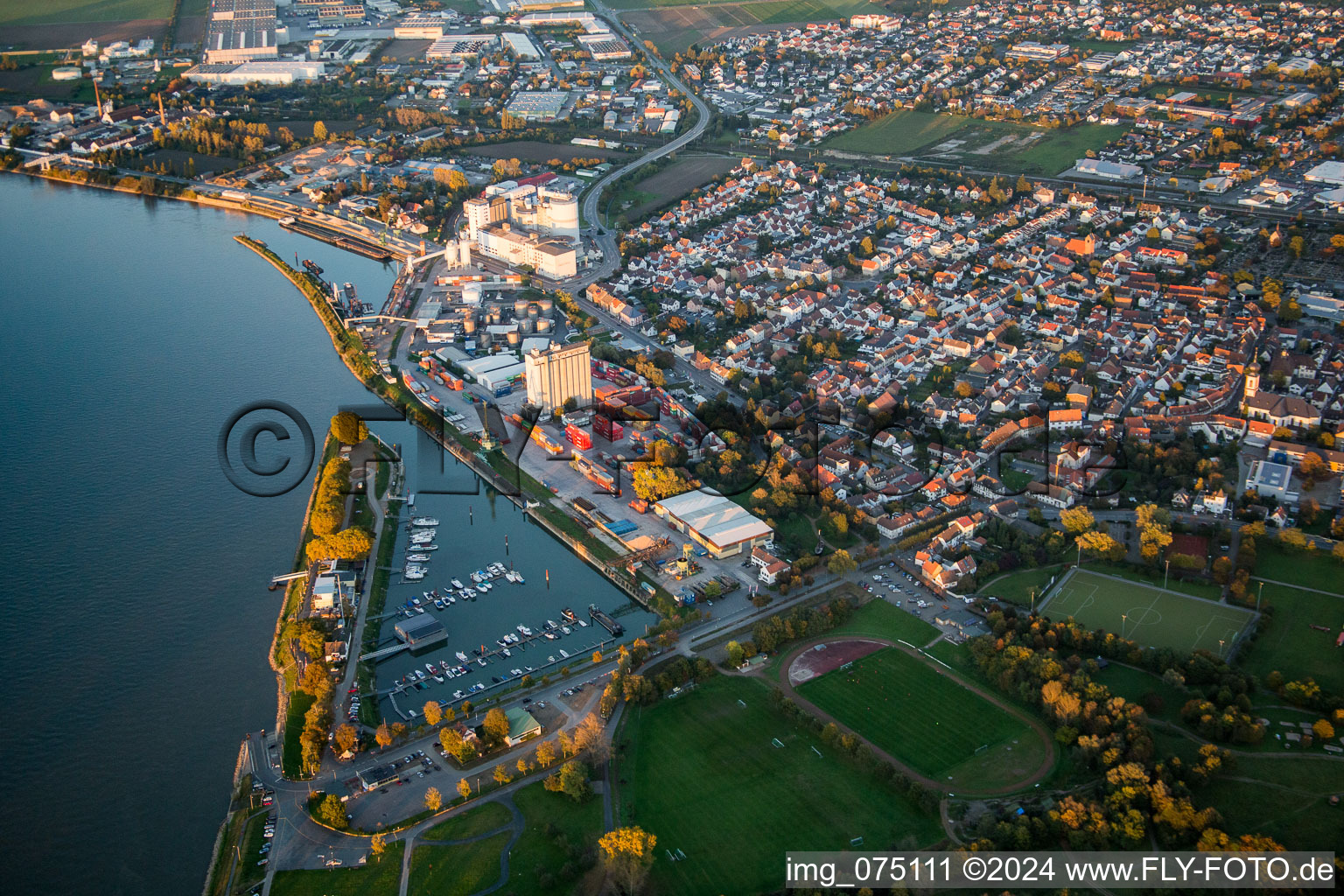 Aerial view of City center in the downtown area on the banks of river course of the Rhine river in Gernsheim in the state Hesse, Germany