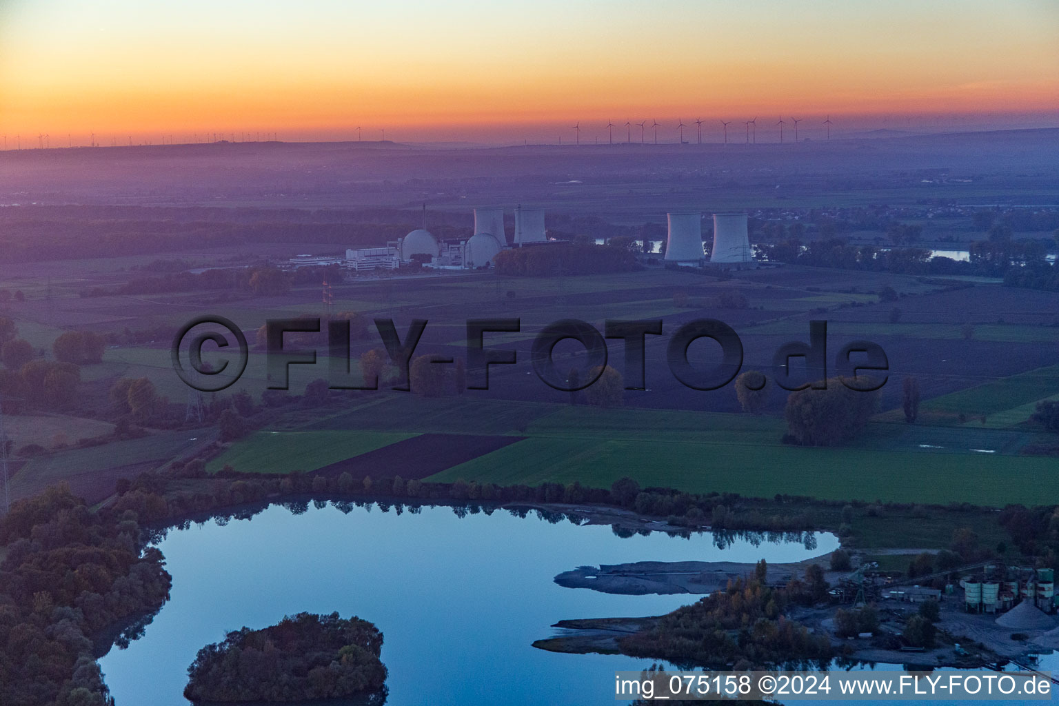 Nuclear power plant behind quarry lake in Groß-Rohrheim in the state Hesse, Germany