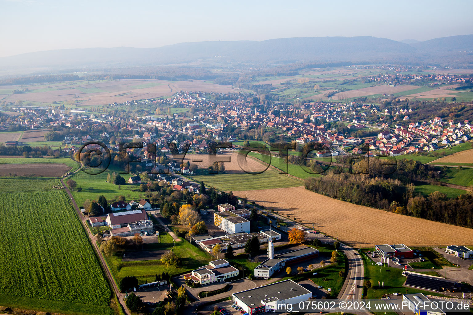 Aerial view of Village - view on the edge of agricultural fields and farmland in Soultz-sous-Forets in Grand Est, France