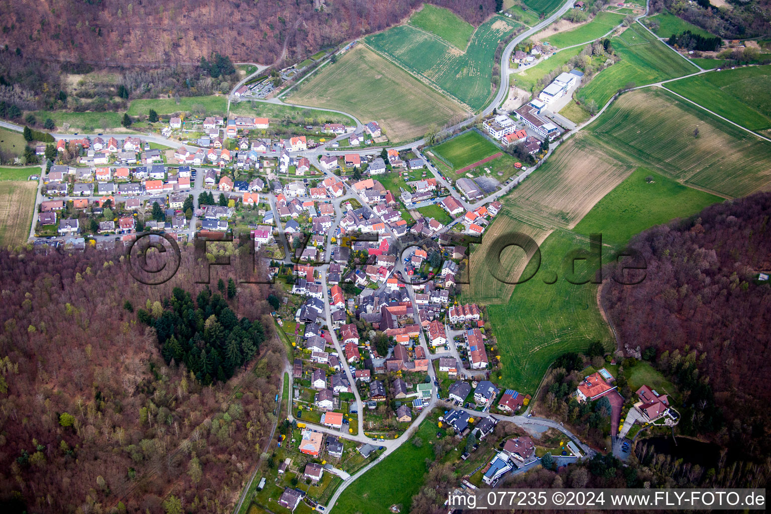 Aerial view of Village - view on the edge of agricultural fields and farmland in Waschenbach in the state Hesse, Germany