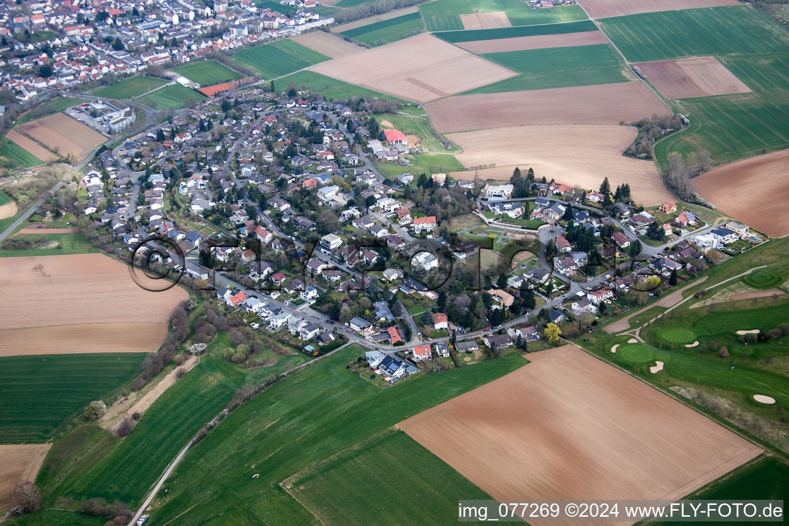 Village - view on the edge of agricultural fields and farmland in the district Gundernhausen in Rossdorf in the state Hesse, Germany