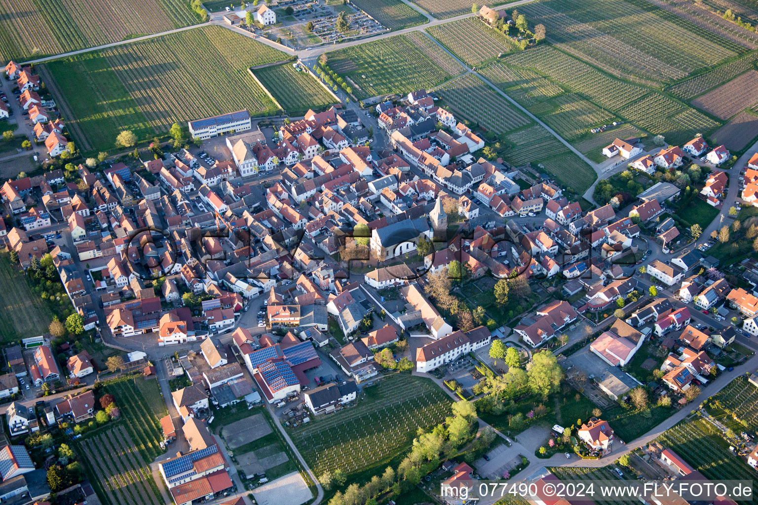 Village - view on the edge of agricultural fields and farmland in Kirrweiler (Pfalz) in the state Rhineland-Palatinate, Germany