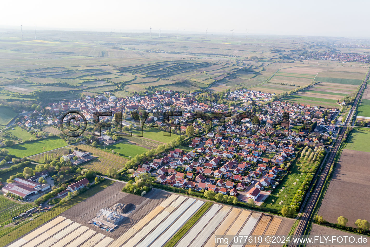 Village - view on the edge of agricultural fields and farmland in Mettenheim in the state Rhineland-Palatinate, Germany