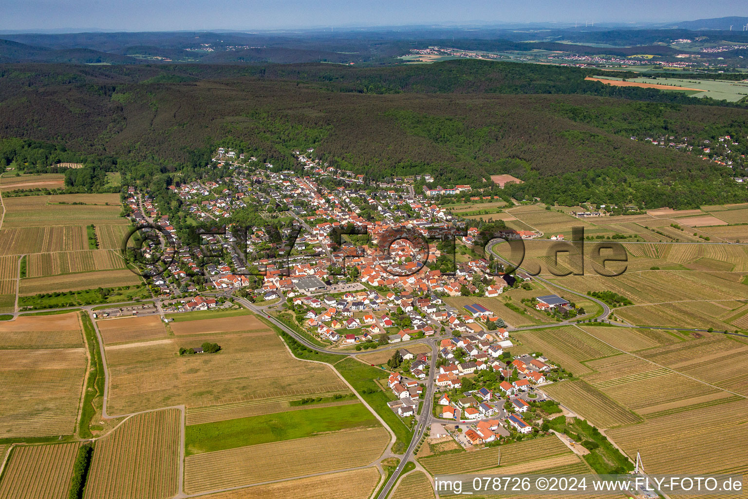 Village - view on the edge of agricultural fields and farmland in Weisenheim am Berg in the state Rhineland-Palatinate, Germany