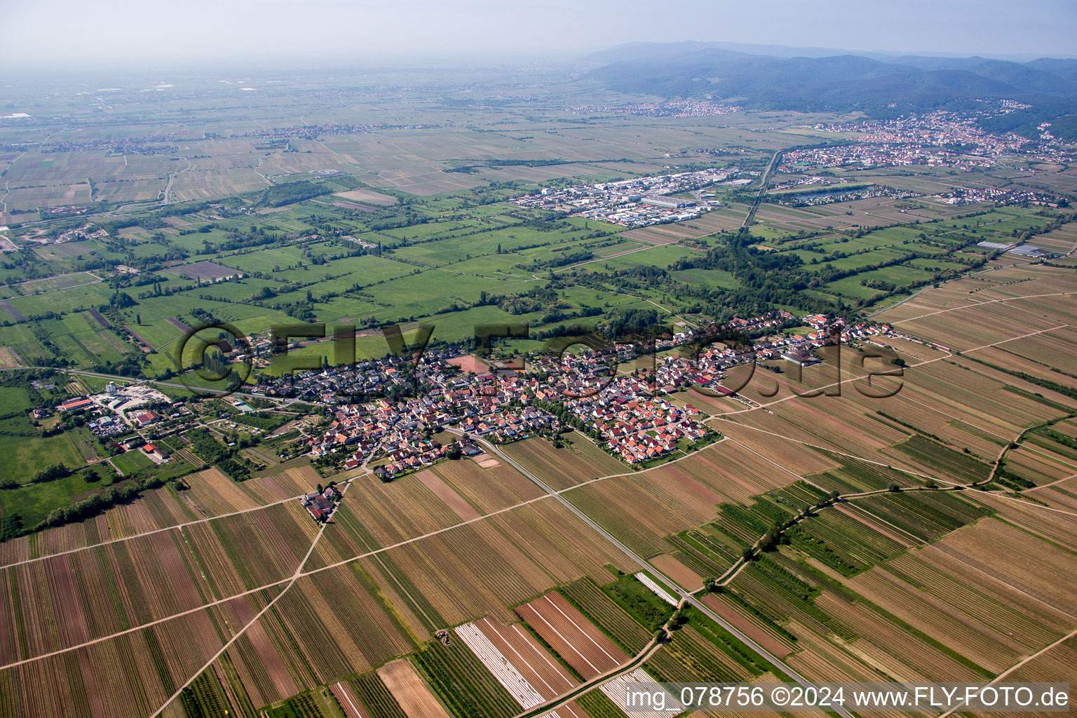 Village - view on the edge of agricultural fields and farmland in Erpolzheim in the state Rhineland-Palatinate