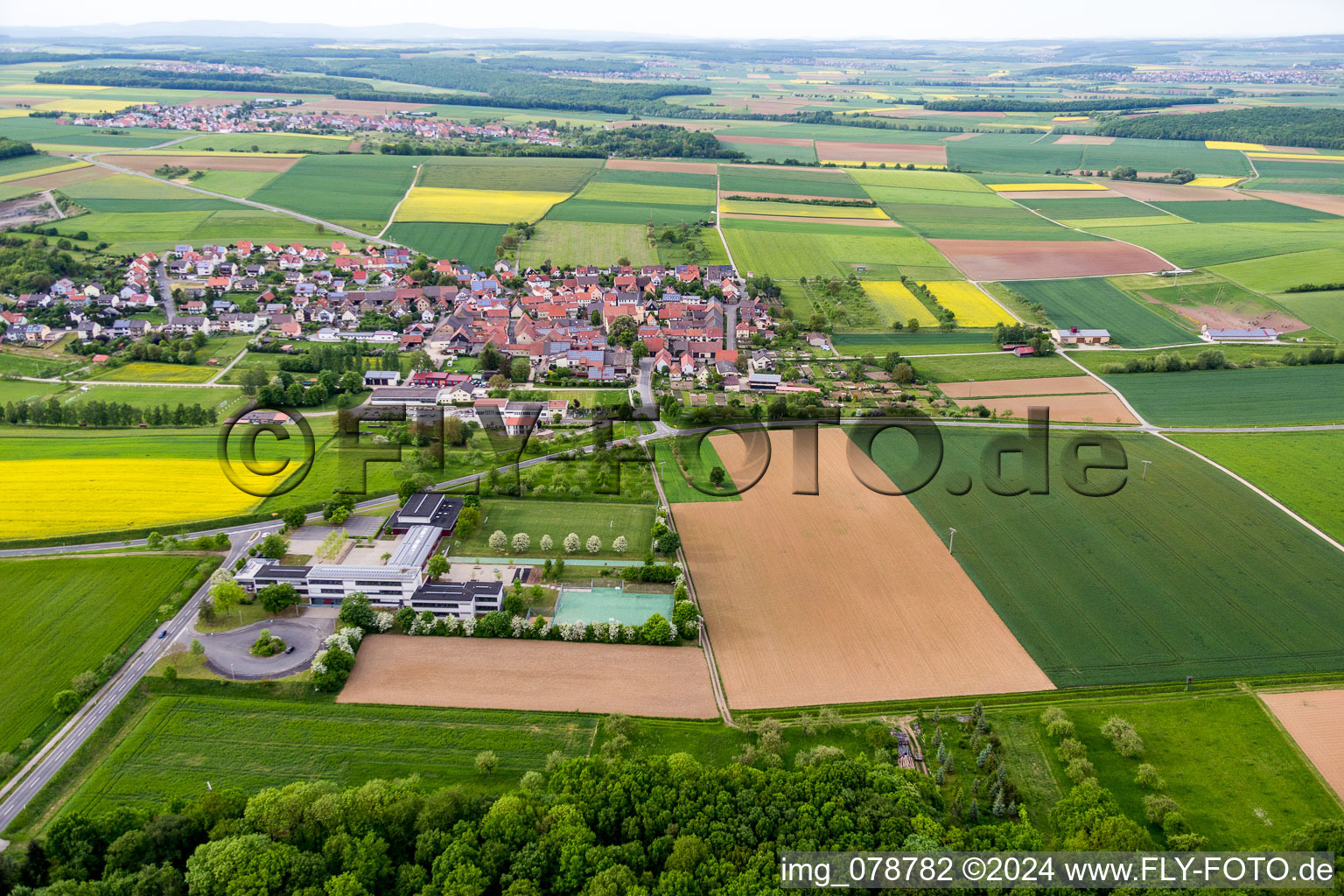 Village - view on the edge of agricultural fields and farmland in Schleerieth in the state Bavaria, Germany