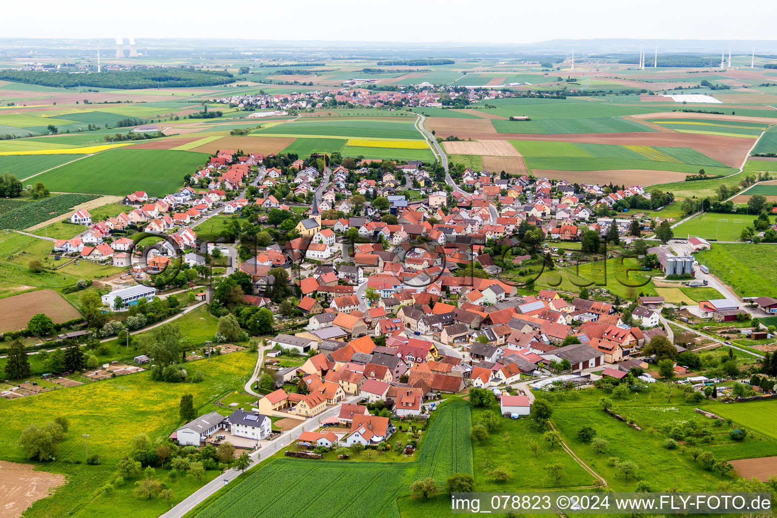 Aerial view of Village - view on the edge of agricultural fields and farmland in the district Rieden in Hausen in the state Bavaria, Germany