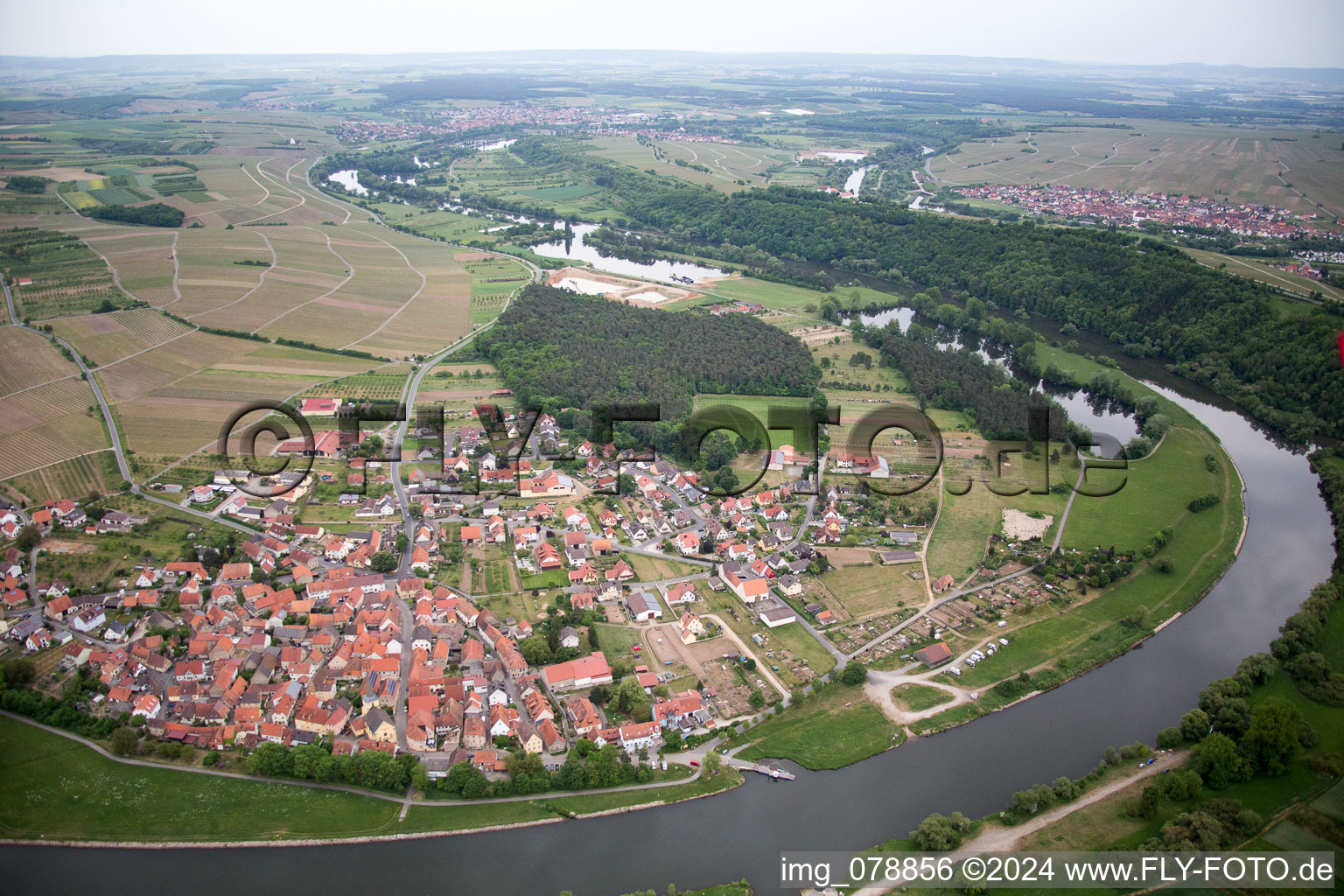 Village on the river bank areas of the loop of the river in Volkach in the state Bavaria, Germany