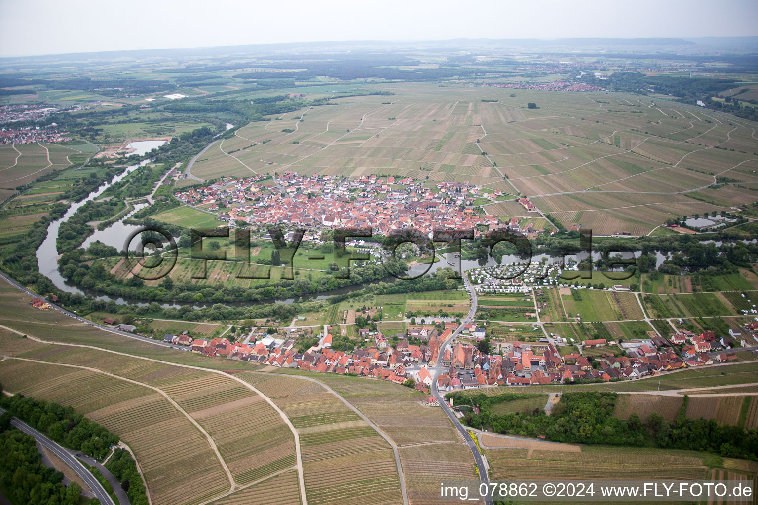 Aerial view of Village on the river bank areas of the loop of the river in Volkach in the state Bavaria, Germany