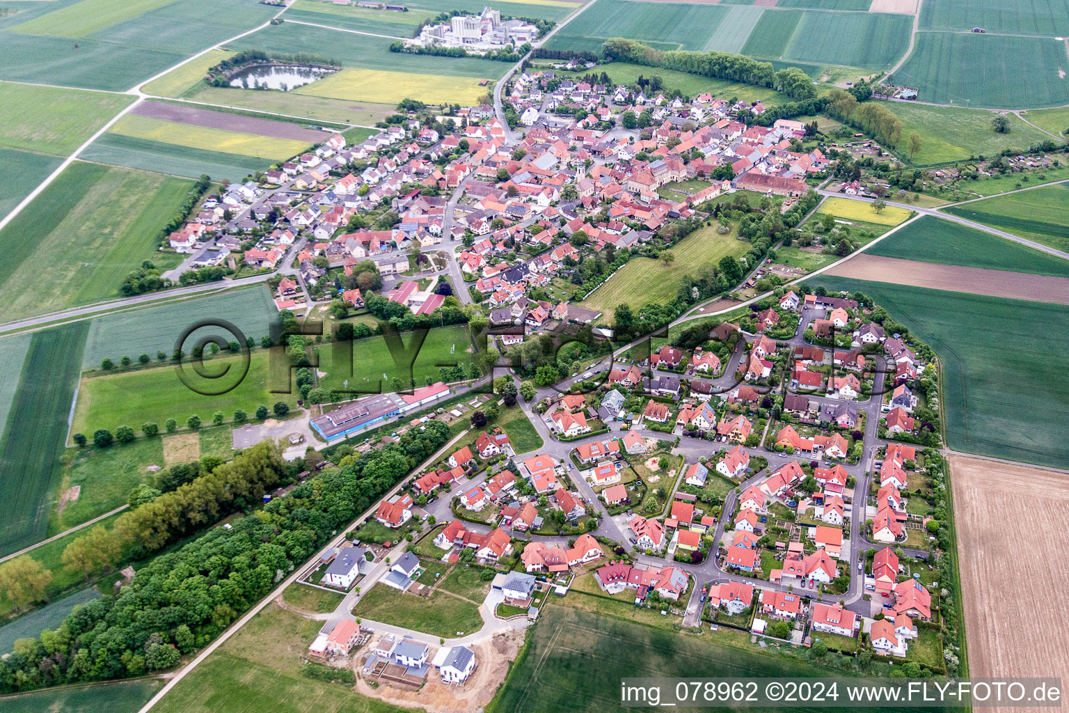 Village - view on the edge of agricultural fields and farmland in Sulzheim in the state Bavaria, Germany