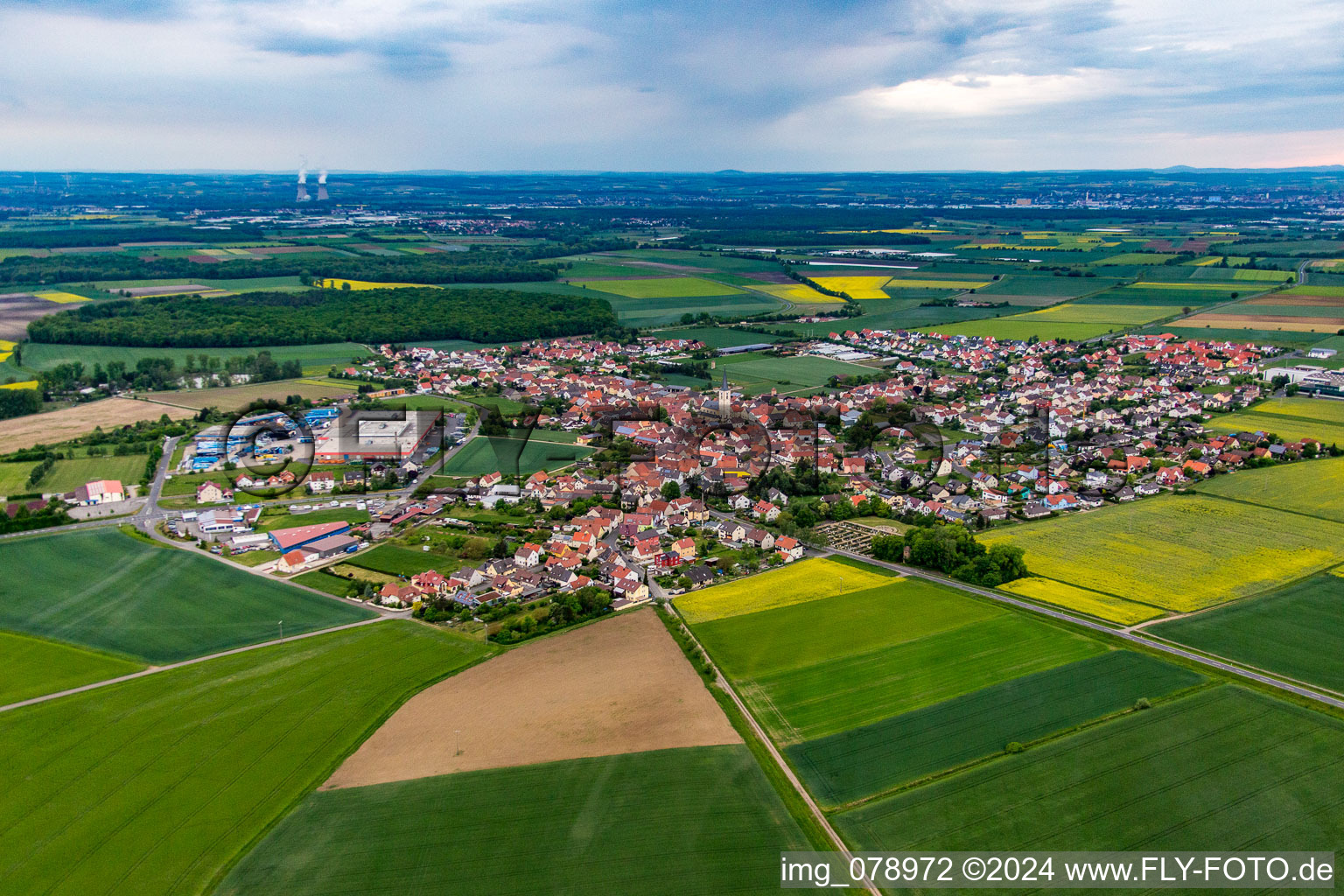 Village - view on the edge of agricultural fields and farmland in Grettstadt in the state Bavaria, Germany