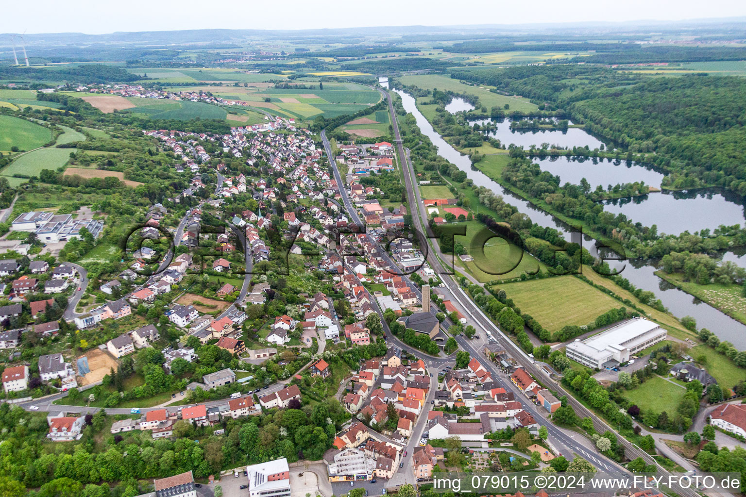 Aerial view of Village on the river bank areas of the Main river in Schonungen in the state Bavaria, Germany