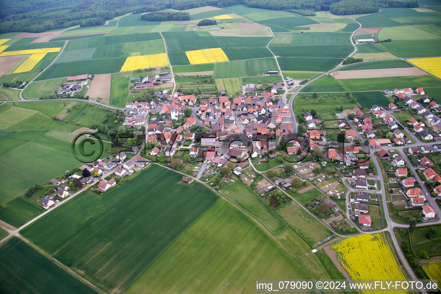 Aerial photograpy of Village - view on the edge of agricultural fields and farmland in Ebertshausen in the state Bavaria