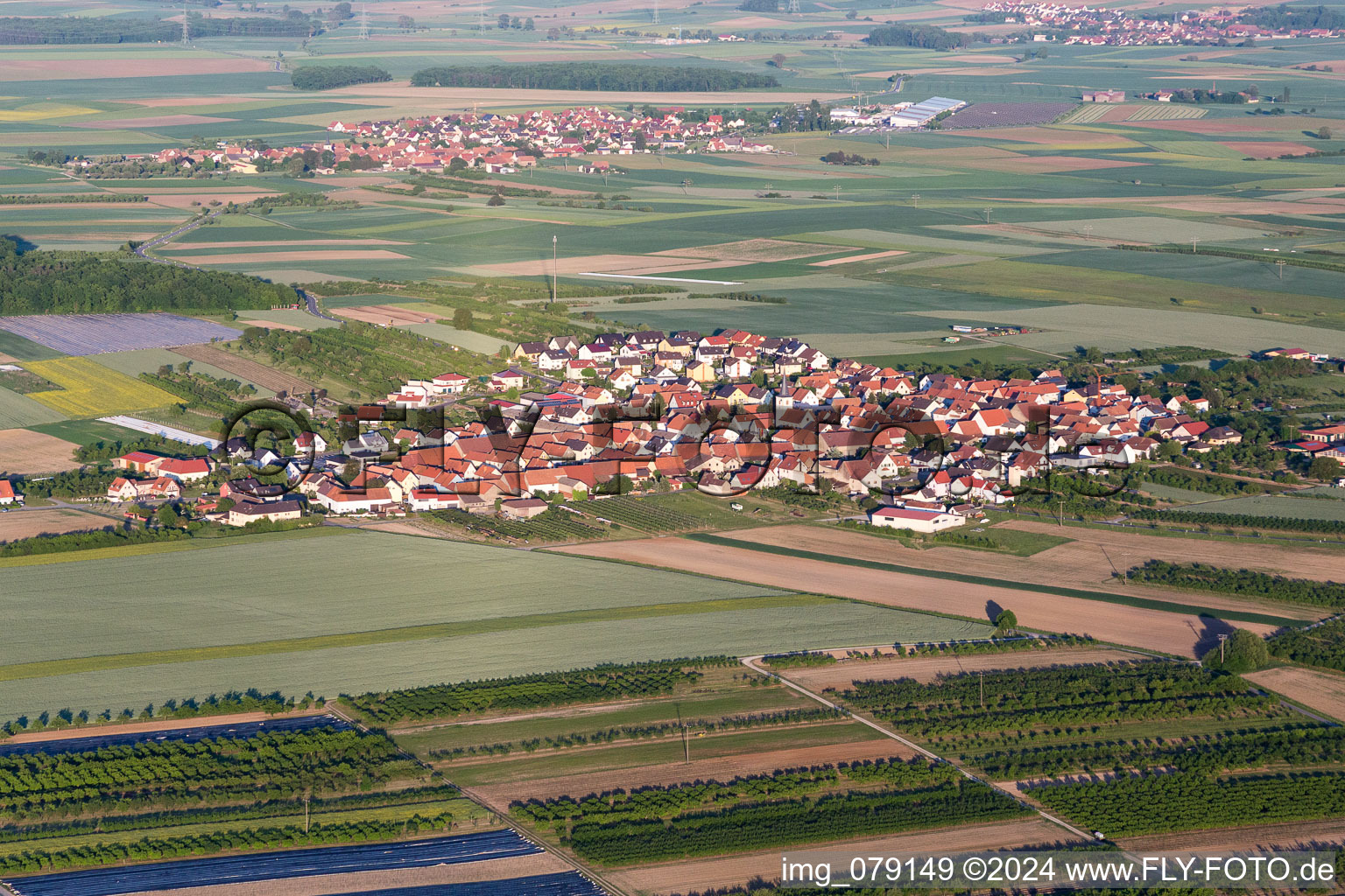 Village - view on the edge of agricultural fields and farmland in the district Theilheim in Waigolshausen in the state Bavaria, Germany