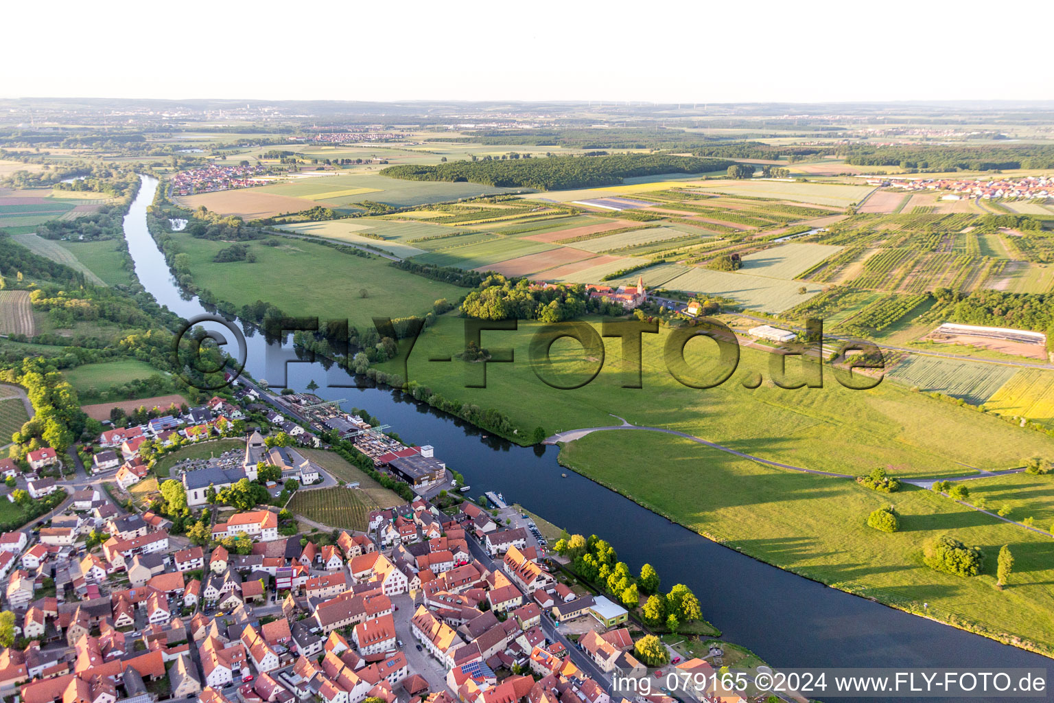 Oblique view of Village on the river bank areas of the Main river in Wipfeld in the state Bavaria, Germany