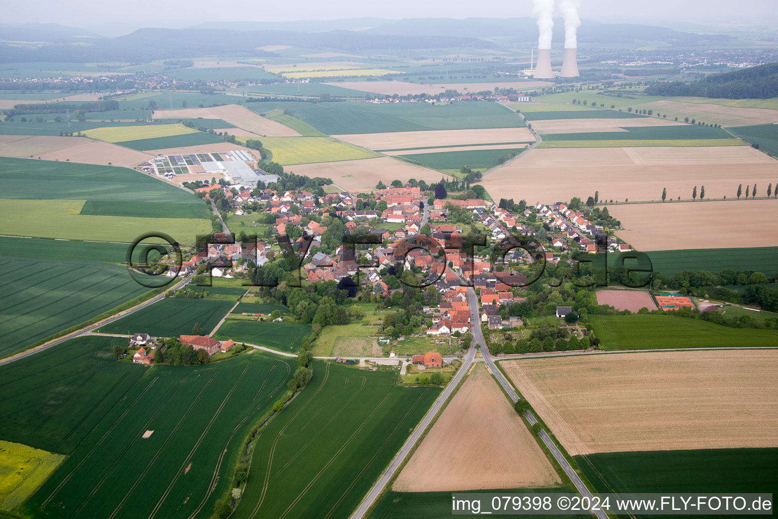 Village - view on the edge of agricultural fields and farmland in Boerry in the state Lower Saxony