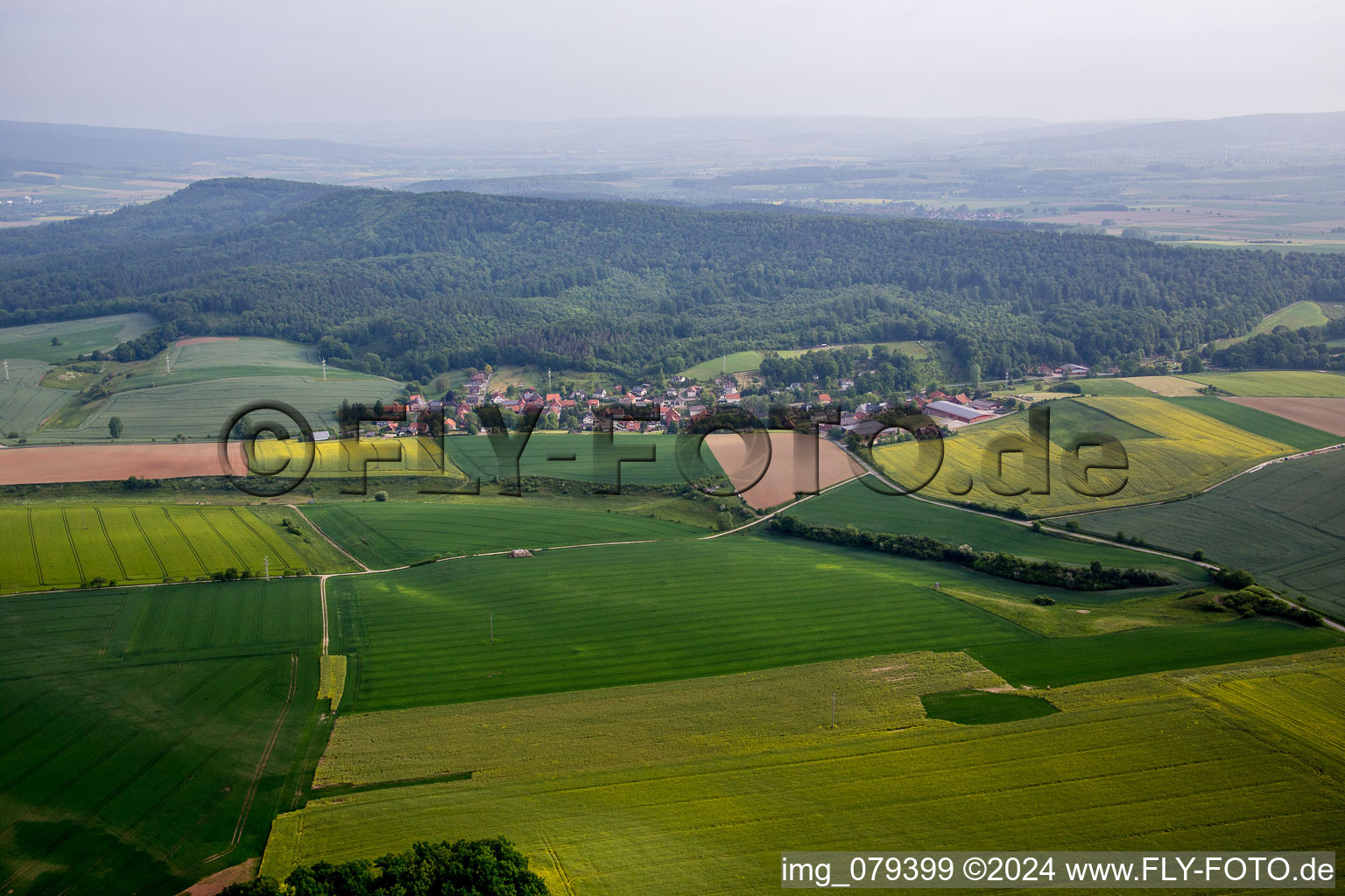 Village - view on the edge of agricultural fields and farmland in Voremberg in the state Lower Saxony, Germany