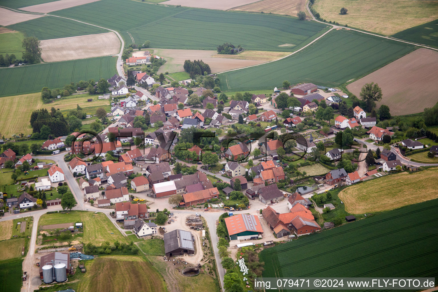 Village - view on the edge of agricultural fields and farmland in the district Luentorf in Emmerthal in the state Lower Saxony, Germany