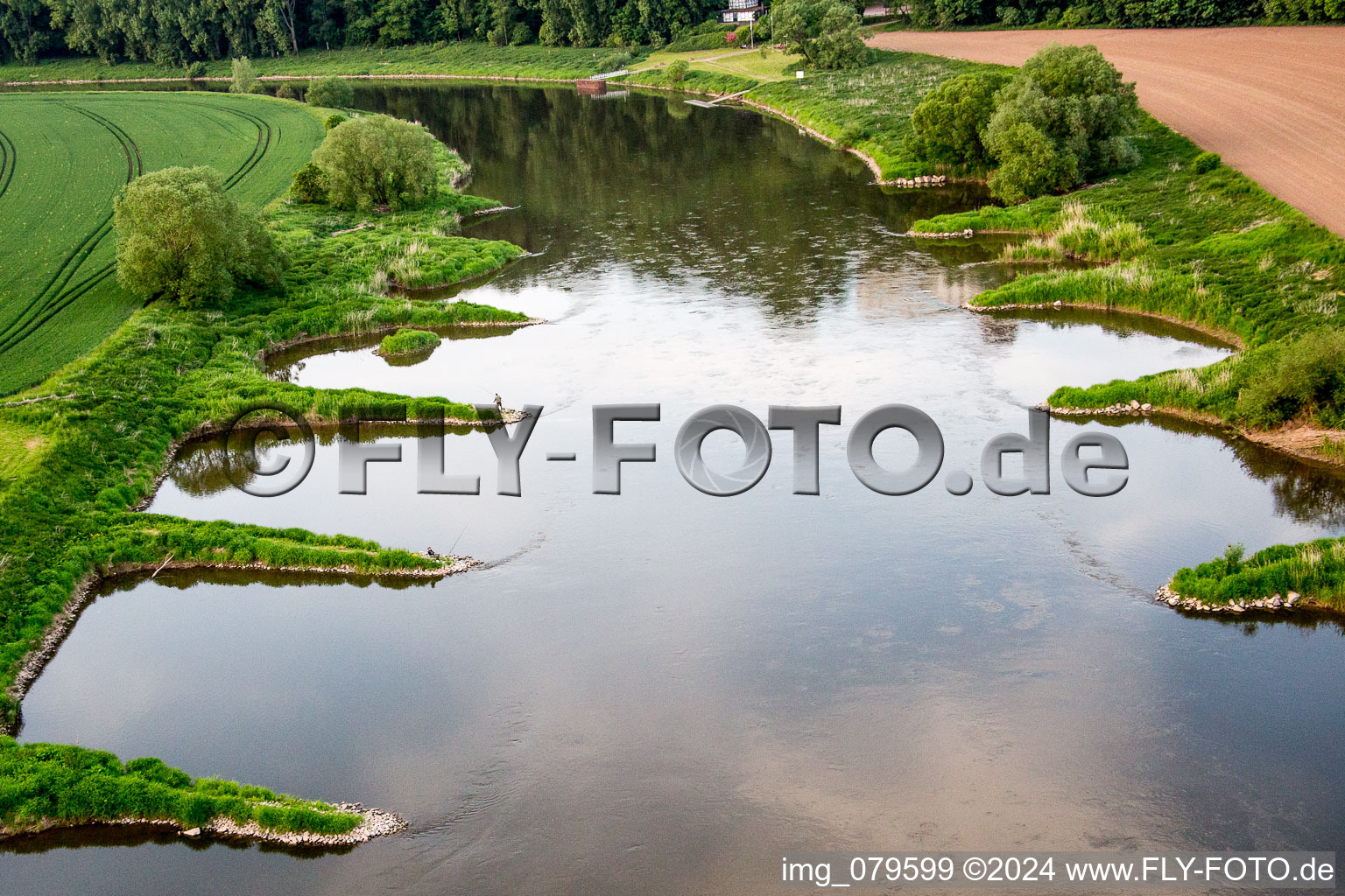 Riparian zones on the course of the river Weser mit Anglern in Fuerstenberg in the state Lower Saxony