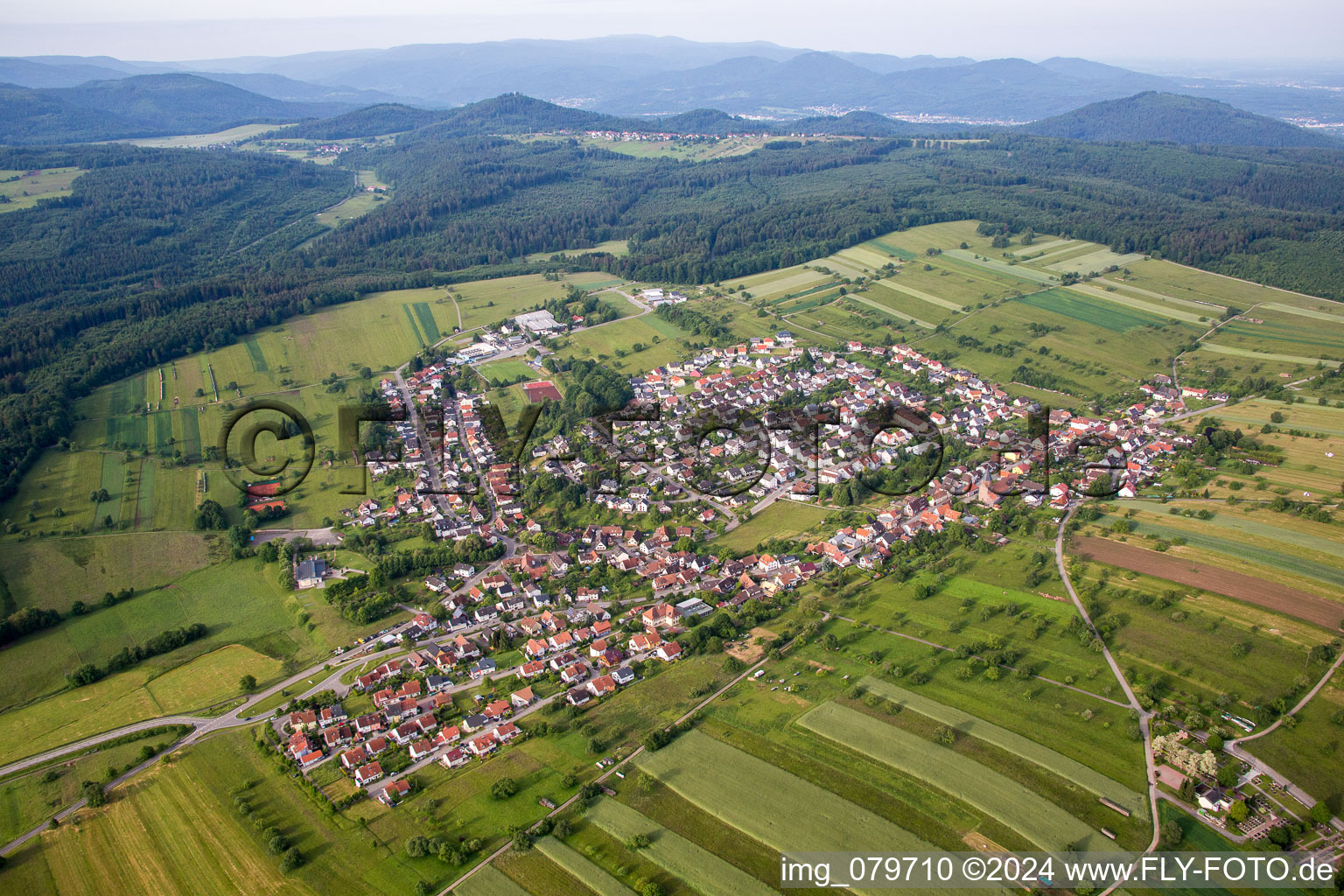 Village - view on the edge of agricultural fields and farmland in Voelkersbach in the state Baden-Wurttemberg, Germany