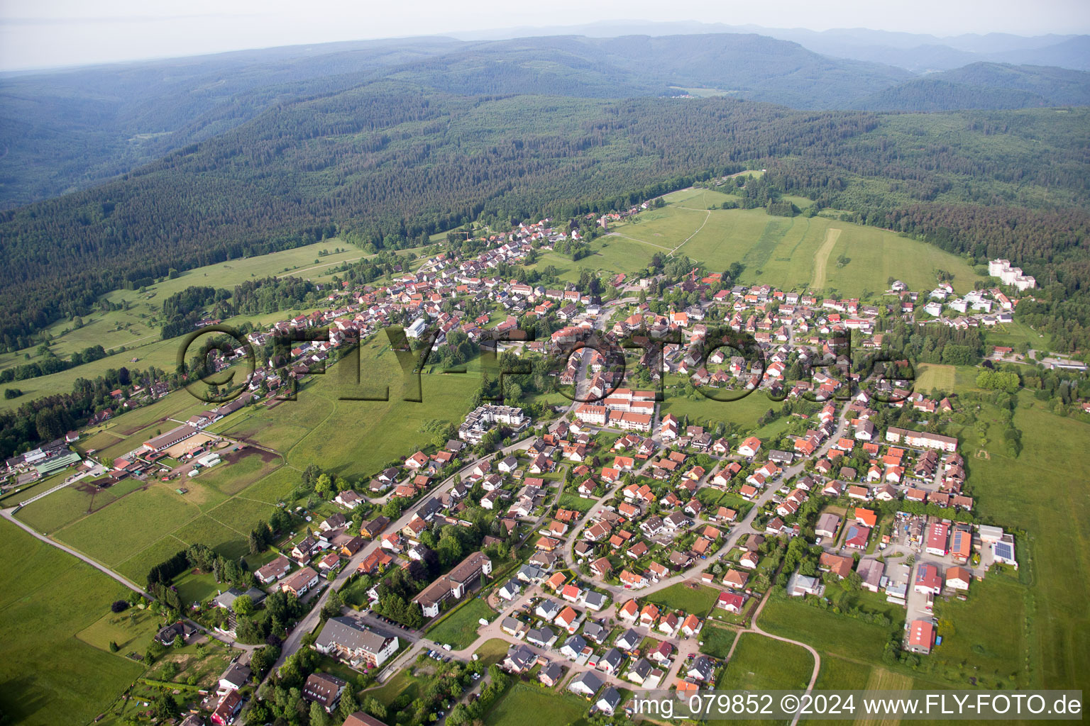 Aerial photograpy of Village - view on the edge of agricultural fields and farmland in Dobel in the state Baden-Wurttemberg