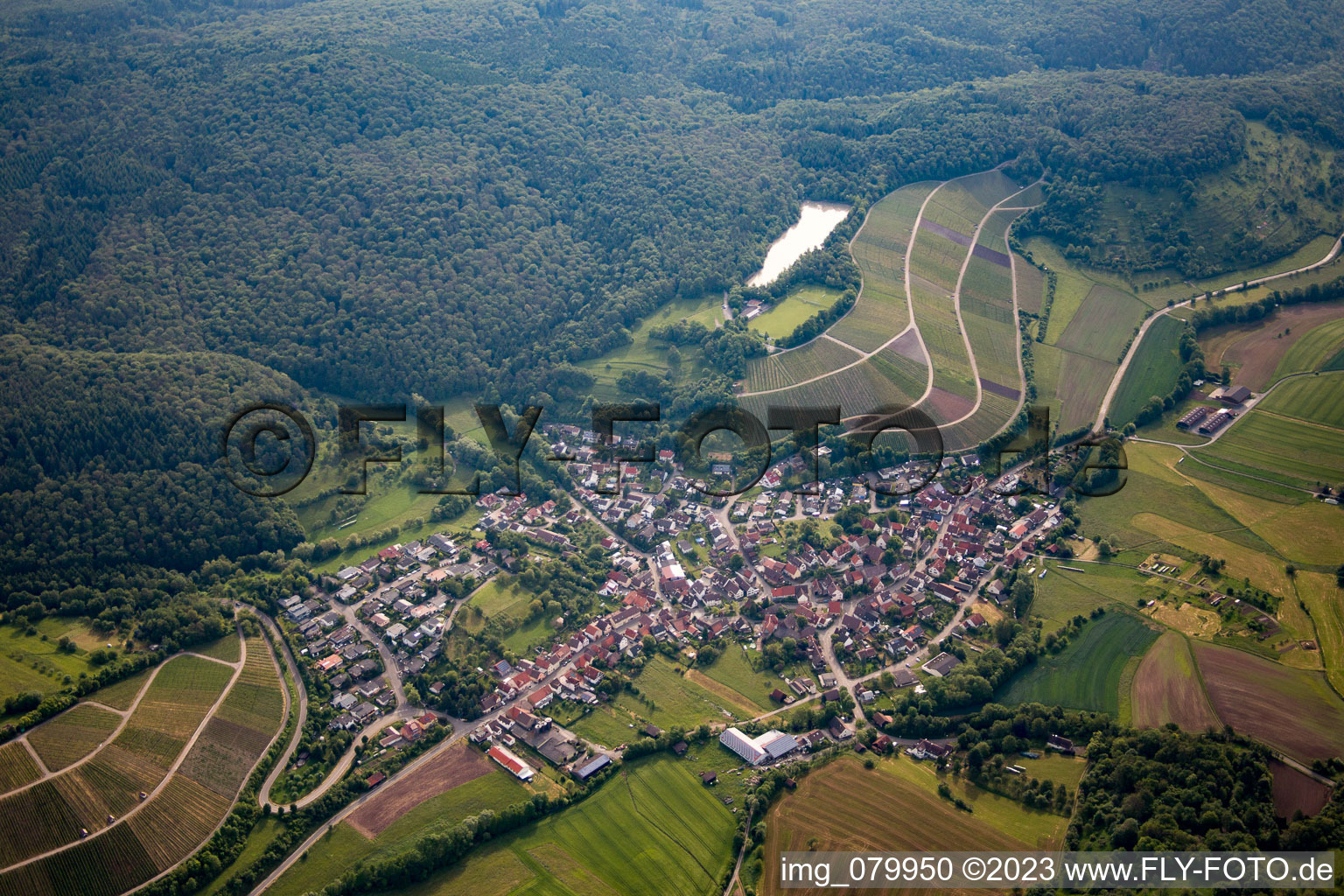 Aerial photograpy of Village - view on the edge of agricultural fields and farmland in the district Haefnerhaslach in Sachsenheim in the state Baden-Wurttemberg, Germany