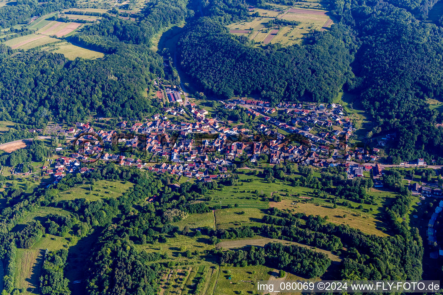 Aerial view of Village - view on the edge of agricultural fields and farmland in Silz in the state Rhineland-Palatinate, Germany