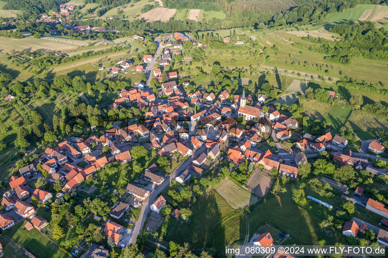 Village - view on the edge of agricultural fields and farmland in Wingen in Grand Est, France