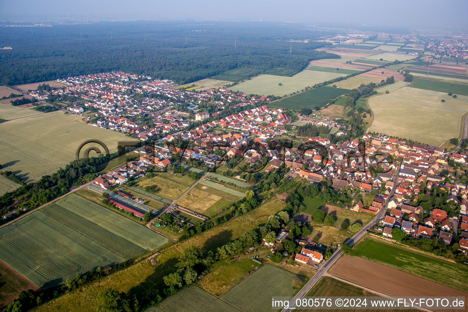 Village - view on the edge of agricultural fields and farmland in Westheim (Pfalz) in the state Rhineland-Palatinate, Germany