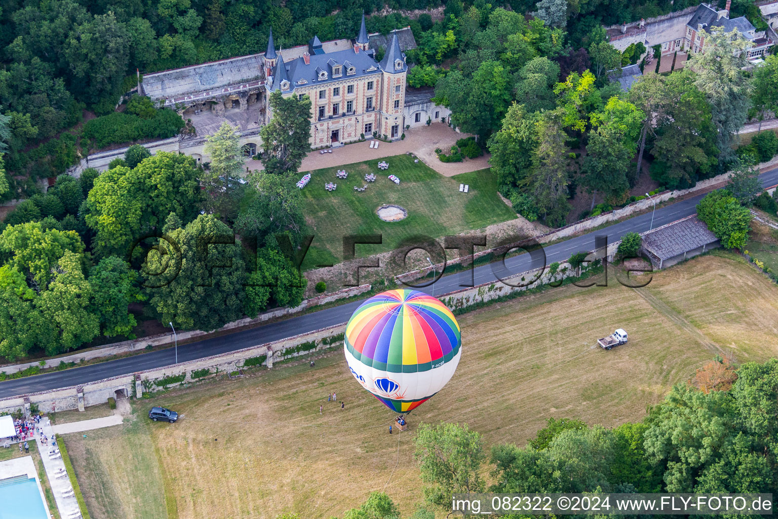 Hot air balloon start on Chateau de Perreux flying over the airspace in Nazelles-Negron in Centre-Val de Loire, France