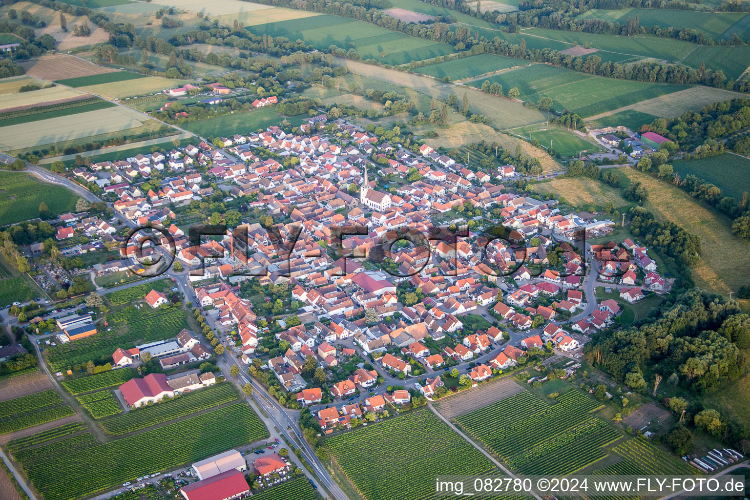 Aerial photograpy of Village - view on the edge of agricultural fields and farmland in Venningen in the state Rhineland-Palatinate, Germany