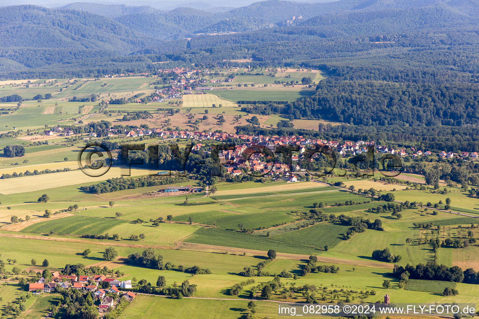 Village - view on the edge of agricultural fields and farmland in FrA?schwiller in Grand Est, France