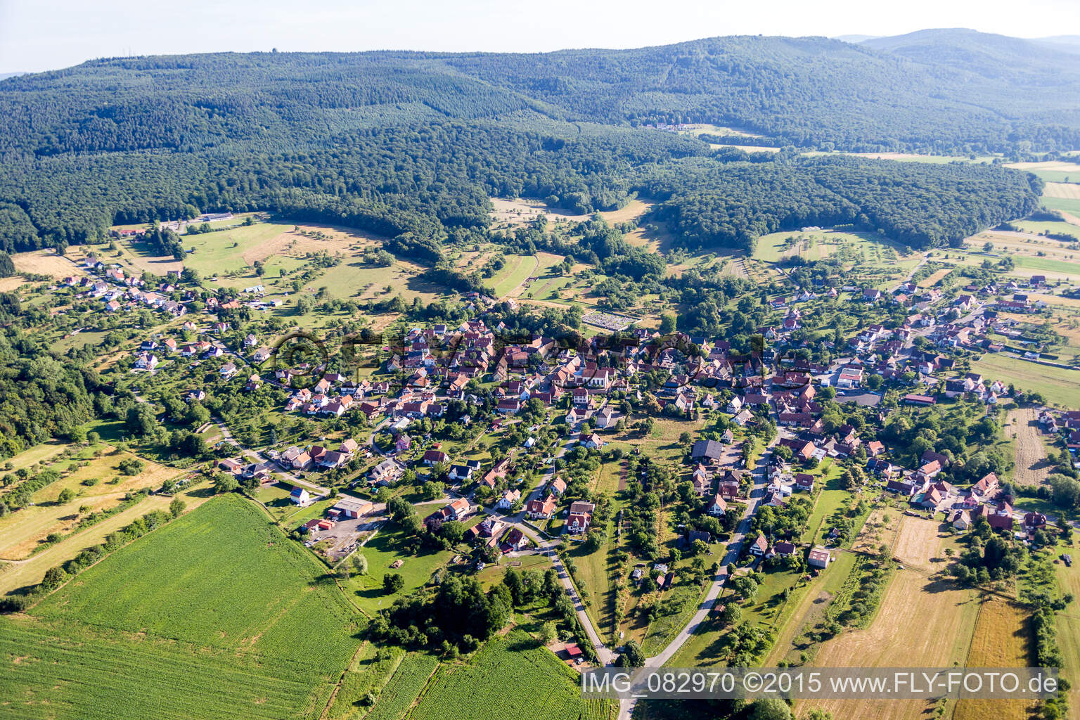 Village - view on the edge of agricultural fields and farmland in Lampertsloch in Grand Est, France