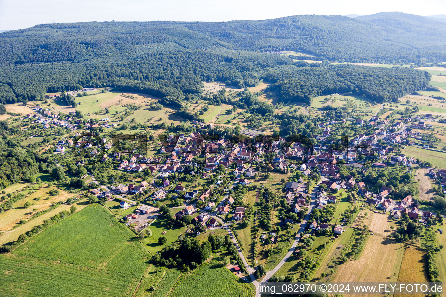 Village - view on the edge of agricultural fields and farmland in Lampertsloch in Grand Est, France