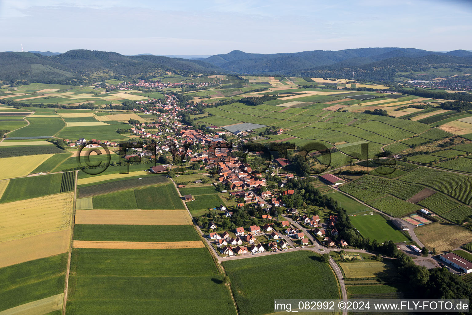 Village - view on the edge of agricultural fields and farmland in Steinseltz in Grand Est, France