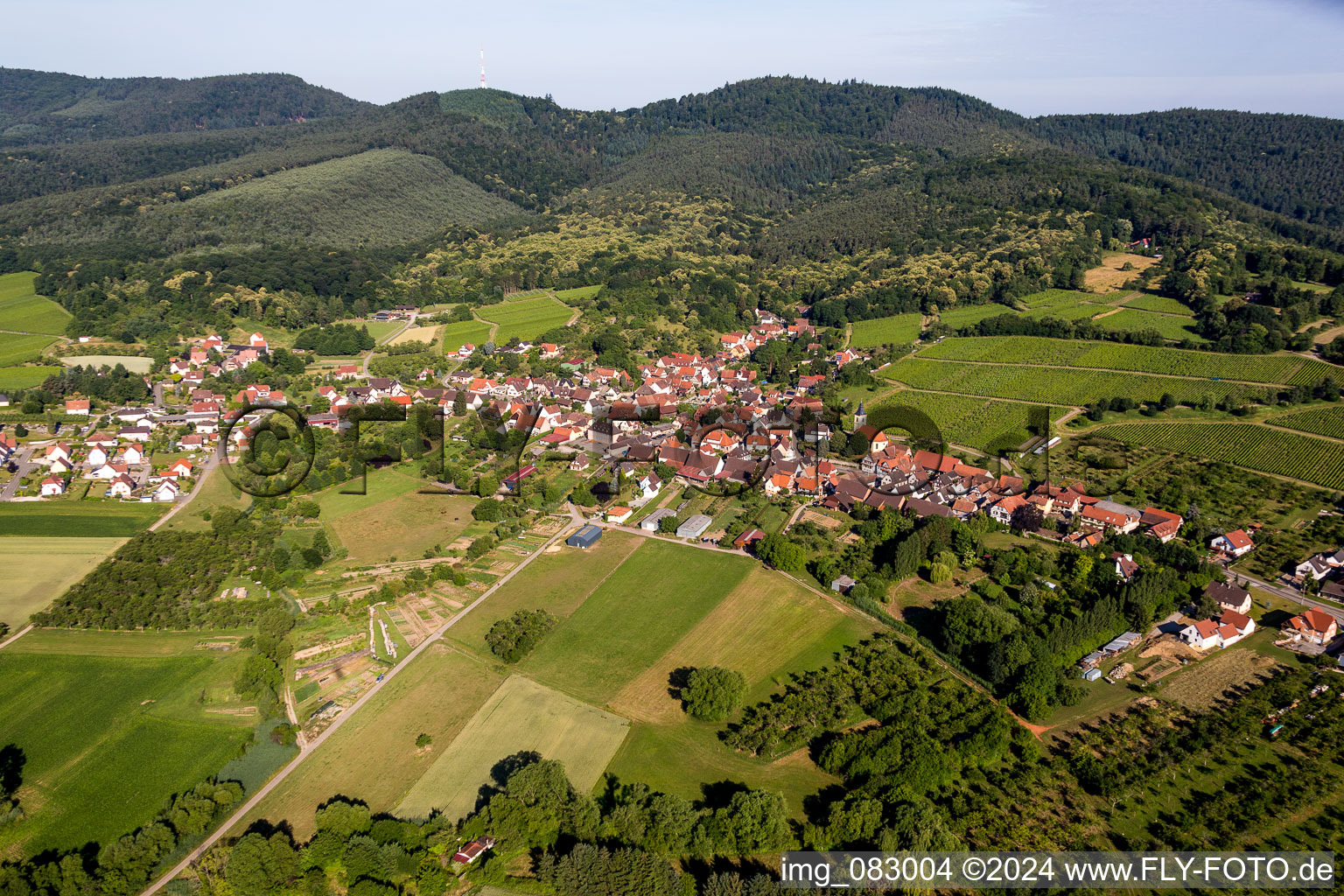 Village - view on the edge of agricultural fields and farmland in Rott in Grand Est, France