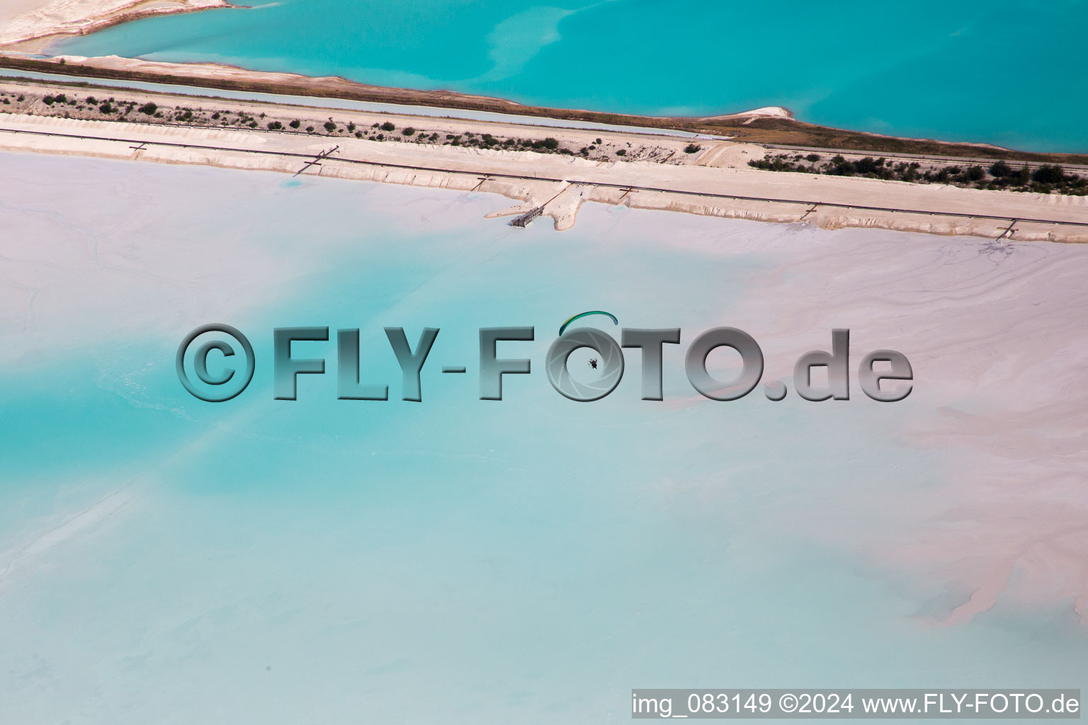 Brown - white salt pans for salt extraction in RosiA?res-aux-Salines in Alsace-Champagne-Ardenne-Lorraine, France seen from above