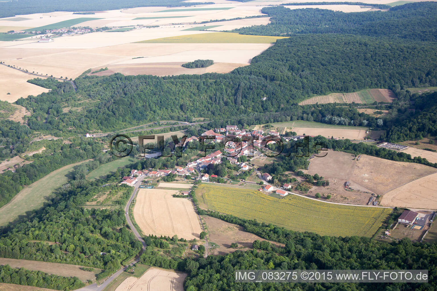 Village - view on the edge of agricultural fields and farmland in Jaulny in Grand Est, France