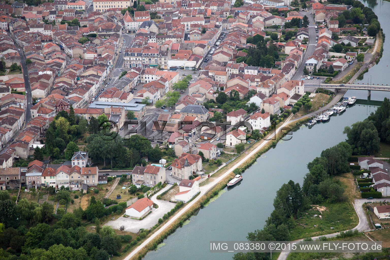 Aerial view of Village on the river bank areas der Meuse in Saint-Mihiel in Grand Est, France
