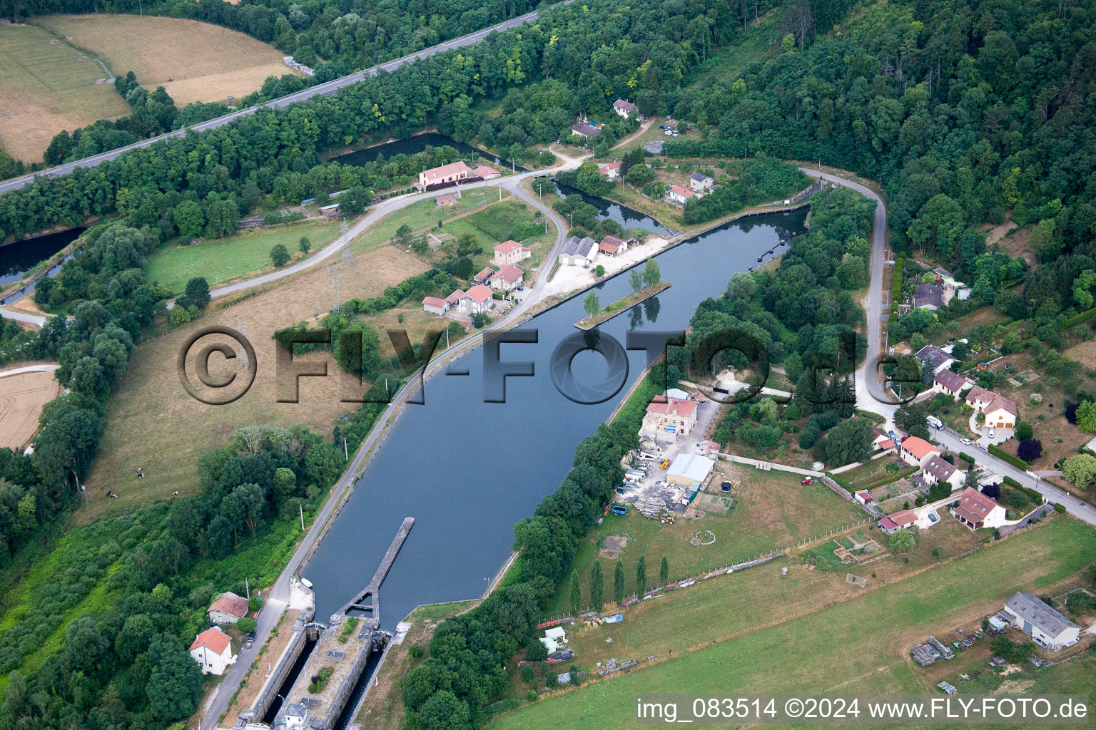 Channel flow through tunnel and river banks of the waterway shipping Rhine to Marne channel in Foug in Grand Est, France