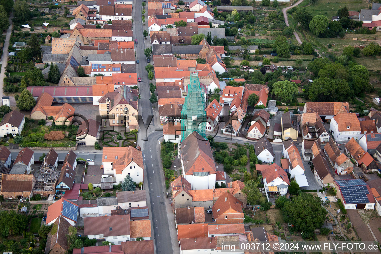 Catholic church scaffolded by Leidner GmbH Gerüstbau, Landau in the district Ottersheim in Ottersheim bei Landau in the state Rhineland-Palatinate, Germany from the drone perspective