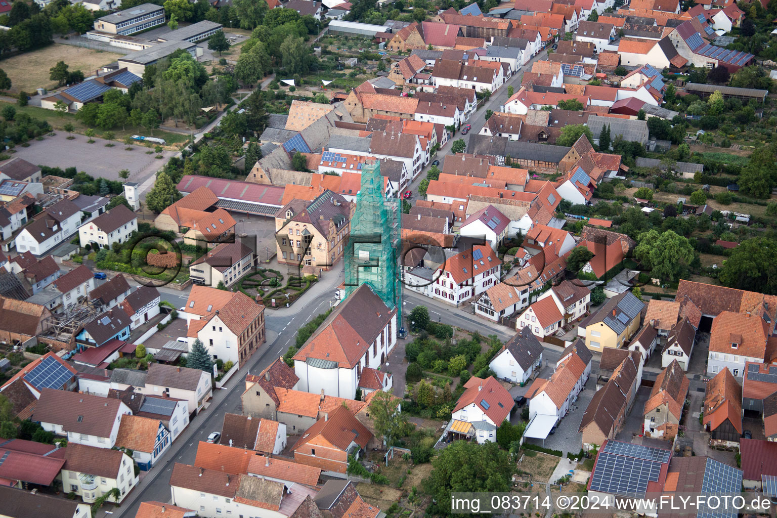 Ottersheim, Catholic church scaffolded by Leidner GmbH Gerüstbau, Landau in Ottersheim bei Landau in the state Rhineland-Palatinate, Germany seen from a drone