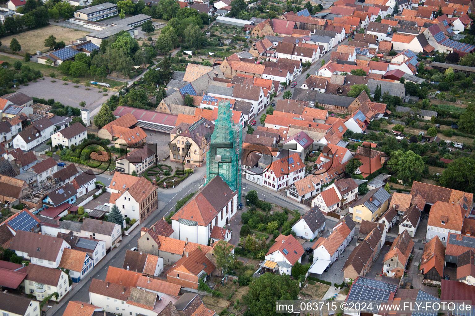 Catholic church scaffolded by Leidner GmbH Gerüstbau, Landau in the district Ottersheim in Ottersheim bei Landau in the state Rhineland-Palatinate, Germany seen from a drone