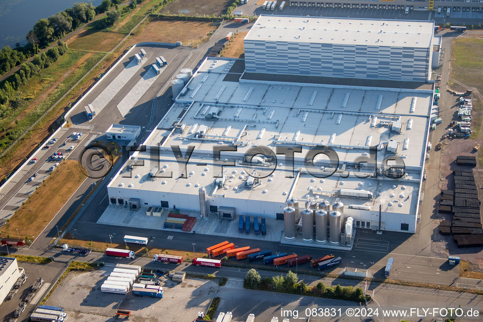Aerial view of Building and production halls on the premises of Pfaelzer Erfrischungsgetraenke GmbH in Woerth am Rhein in the state Rhineland-Palatinate, Germany