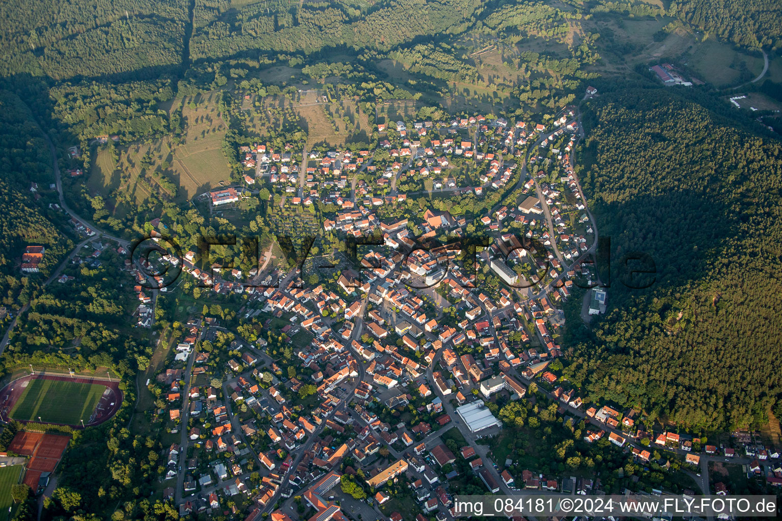 Village - view on the edge of agricultural fields and farmland in Hauenstein in the state Rhineland-Palatinate, Germany