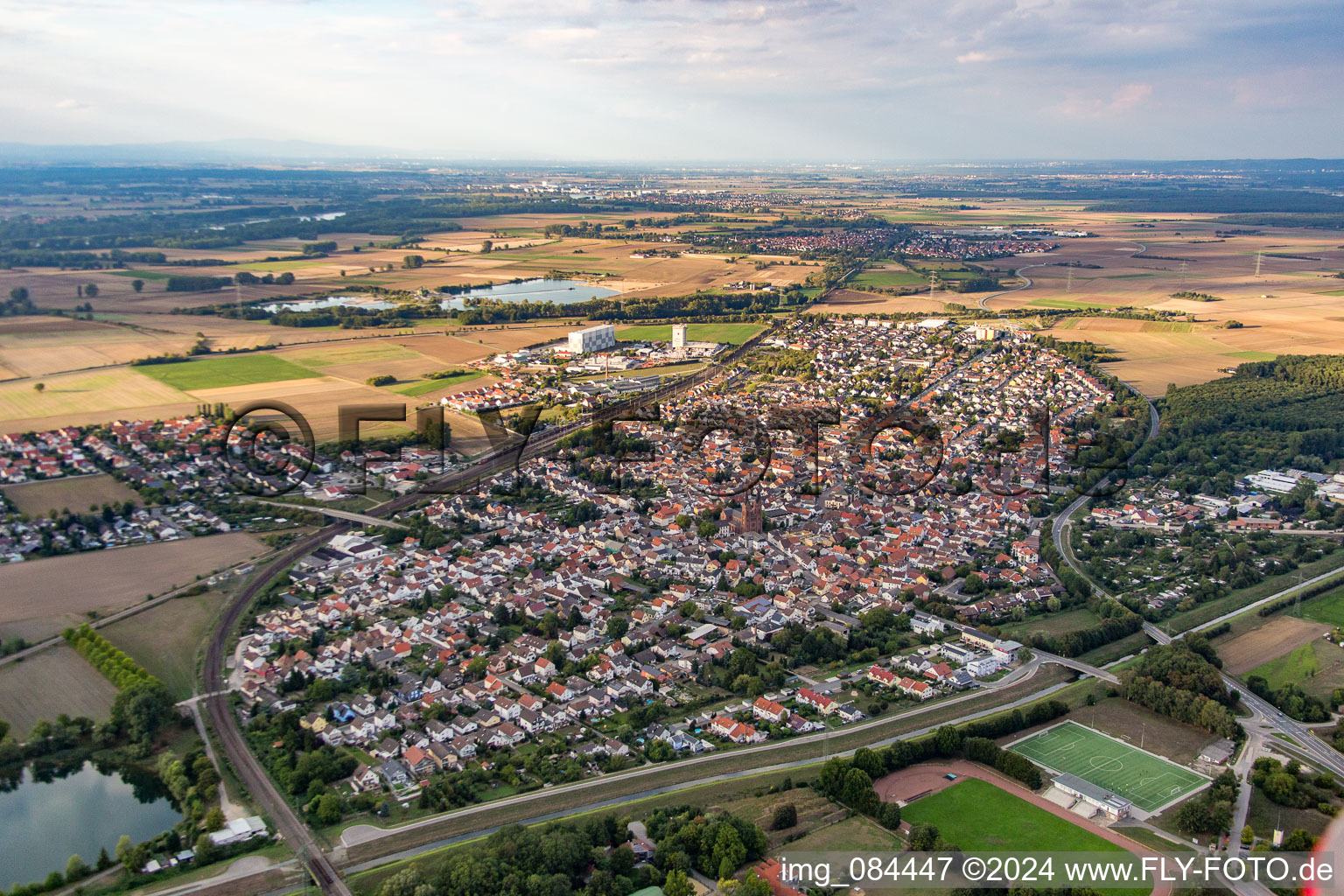 Oblique view of Town View of the streets and houses of the residential areas in Biblis in the state Hesse