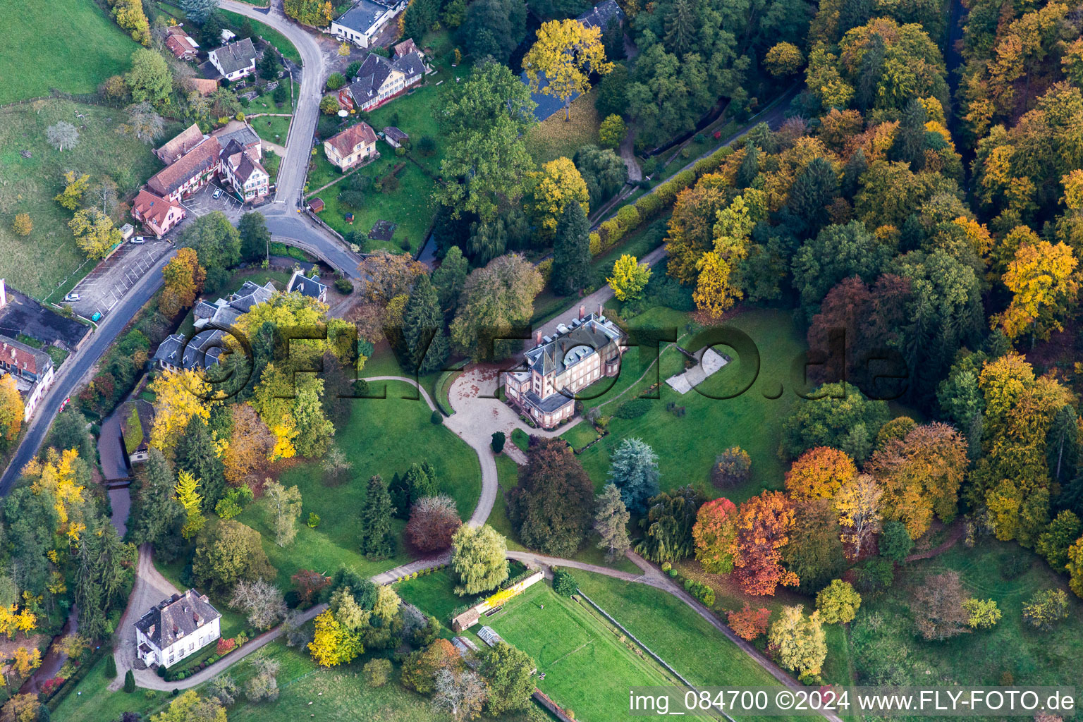 Aerial view of Complex of the hotel building Domaine Jaegerthal in a green valley in the district Jaegerthal in Windstein in Grand Est, France