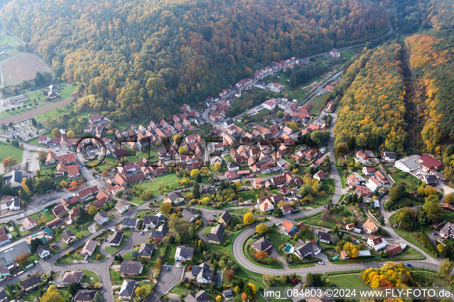 Village - view on the edge of agricultural fields and farmland in Rothbach in Grand Est, France