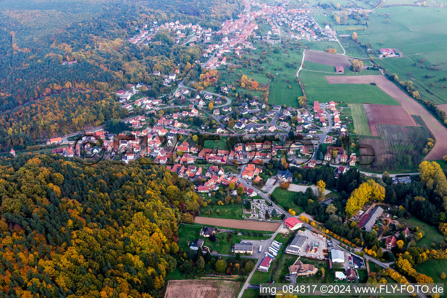 Aerial view of Village - view on the edge of agricultural fields and farmland in Rothbach in Grand Est, France