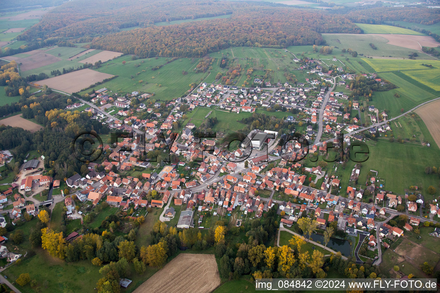 Village - view on the edge of agricultural fields and farmland in Gumbrechtshoffen in Grand Est, France